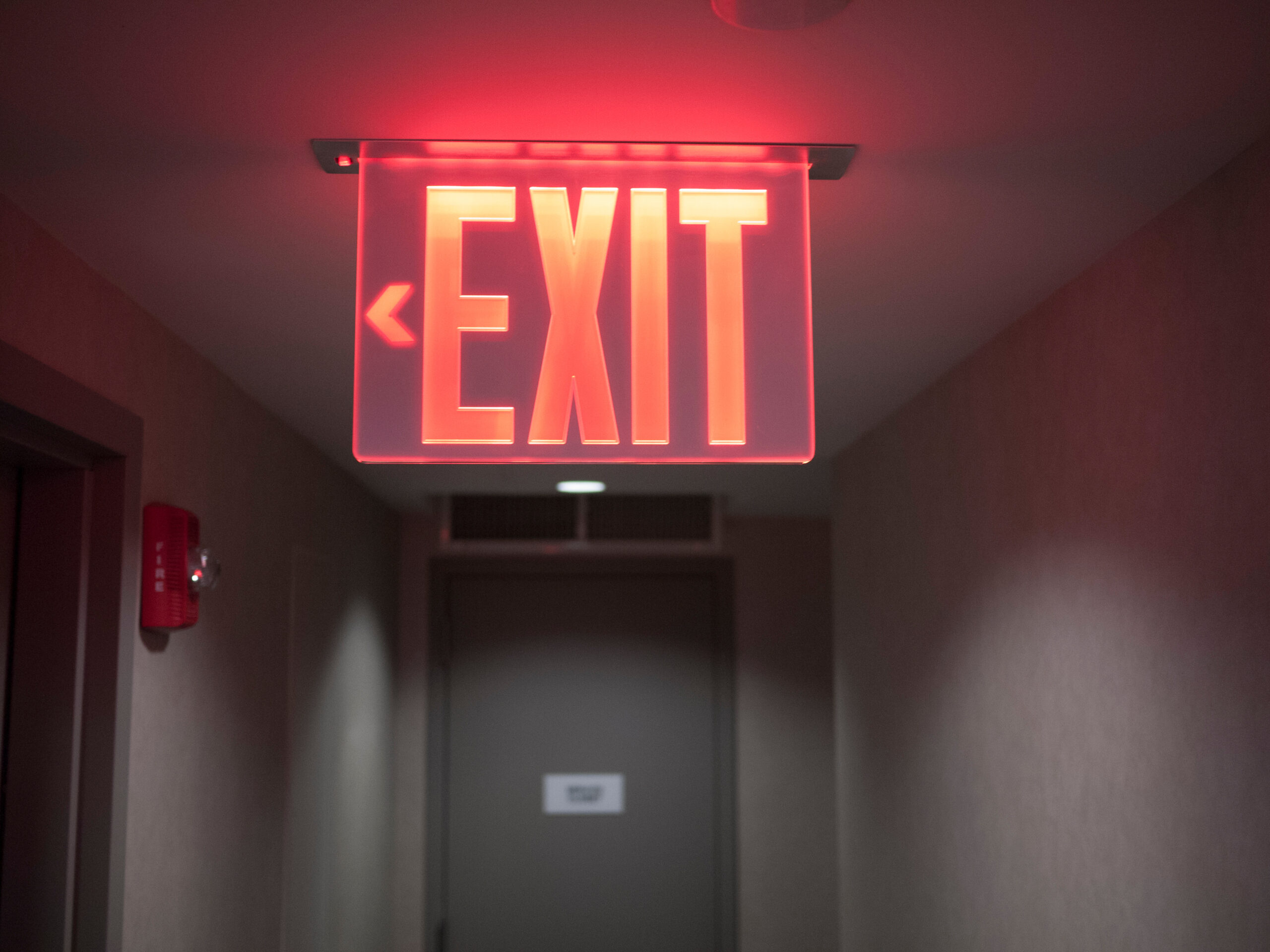 Glowing red exit sign.