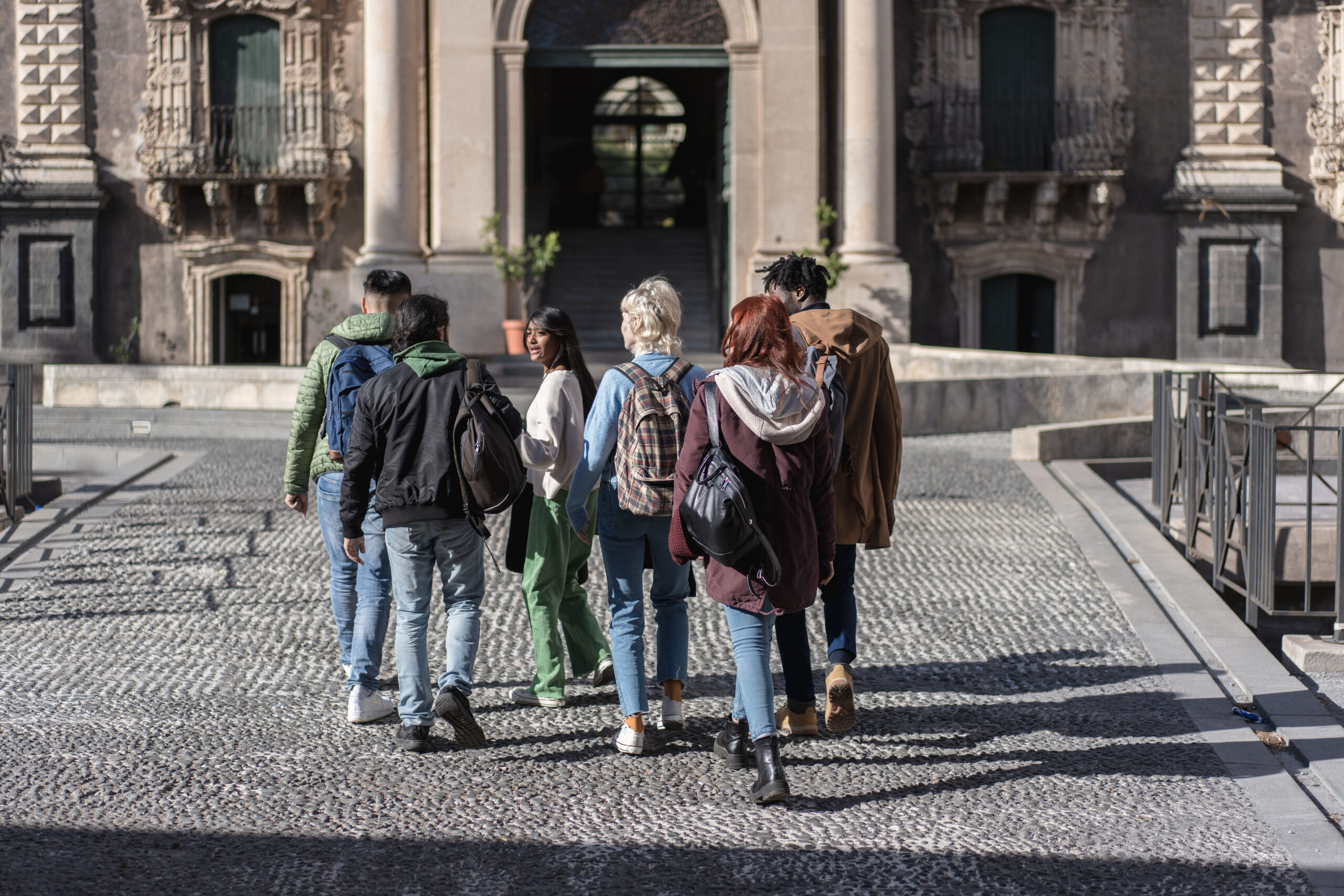 group of students exploring historic university campus